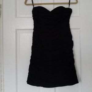 Strapless black dress with full-body ruching